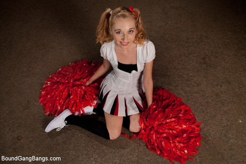 Kink 'Pom Pom Girl gets Gang Banged by Basketball Coach and Team' starring Emma Haize (Photo 1)
