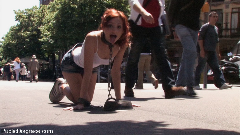 Kink 'Beautiful Spanish redhead tied up, stripped bare, and fucked on the streets' starring Justine (Photo 1)